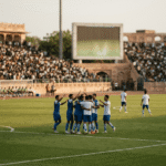 Players celebrating on the pitch after clinching the league title on the final day