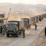 Aid trucks crossing into the Harlowe Corridor at the Bessen Crossing checkpoint